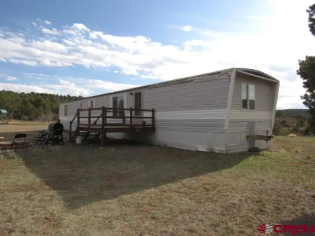 a view of a car park in front of a house