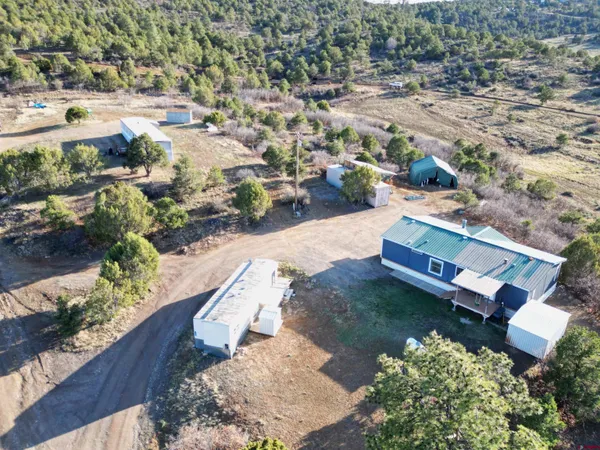 an aerial view of residential houses with outdoor space