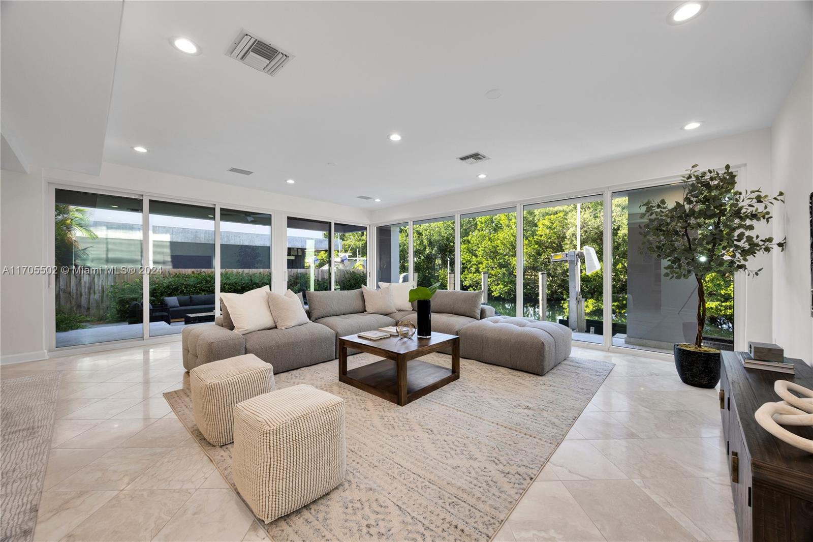 3566 Rockerman Road Miami, FL 33133 - Photo 11 of 43 a living room with furniture and a large window