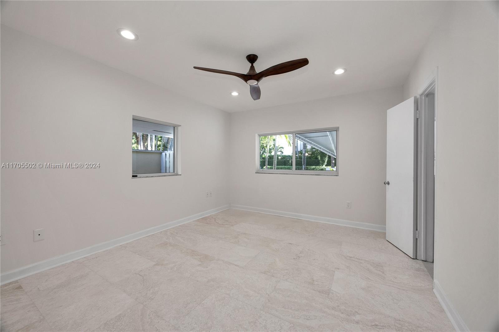 3566 Rockerman Road Miami, FL 33133 - Photo 29 of 43 a view of empty room with windows