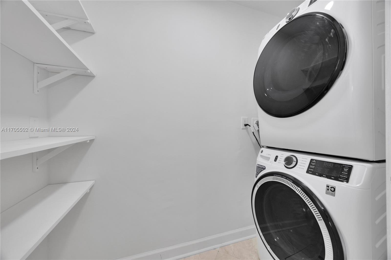 3566 Rockerman Road Miami, FL 33133 - Photo 30 of 43 a utility room with dryer and washer