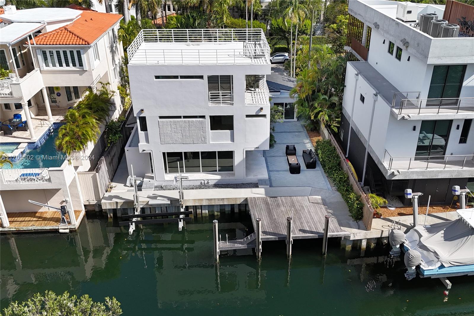 3566 Rockerman Road Miami, FL 33133 - Photo 36 of 43 a aerial view of a house with swimming pool and sitting area