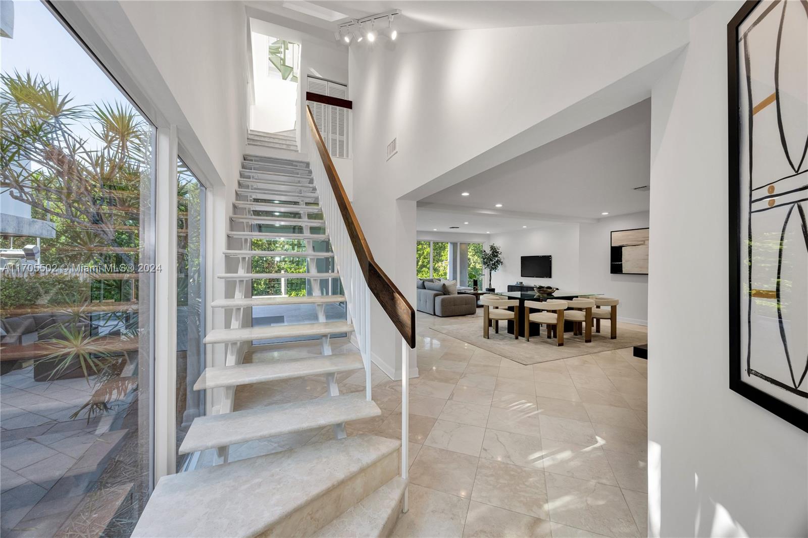 3566 Rockerman Road Miami, FL 33133 - Photo 7 of 43 a view of a livingroom with furniture and a potted plant