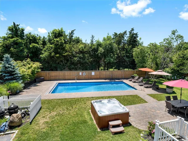 a view of swimming pool with chairs
