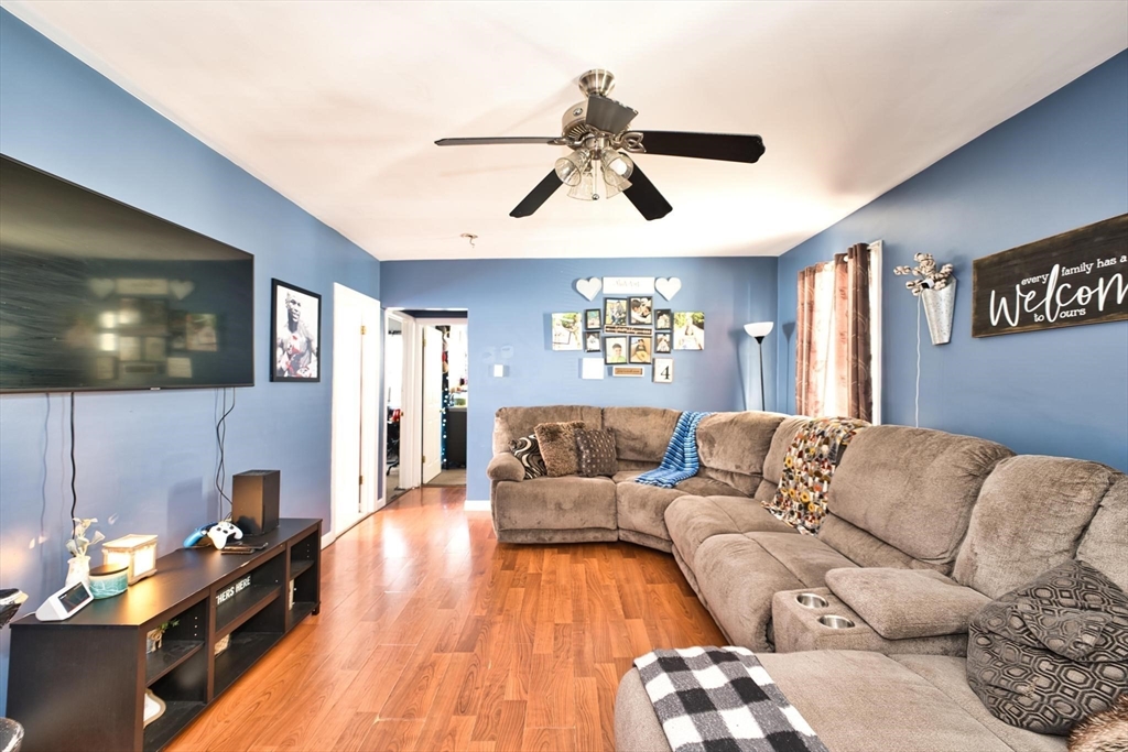 232 Alden Street Fall River, MA 02723 - Photo 18 of 34 a living room with furniture and a flat screen tv