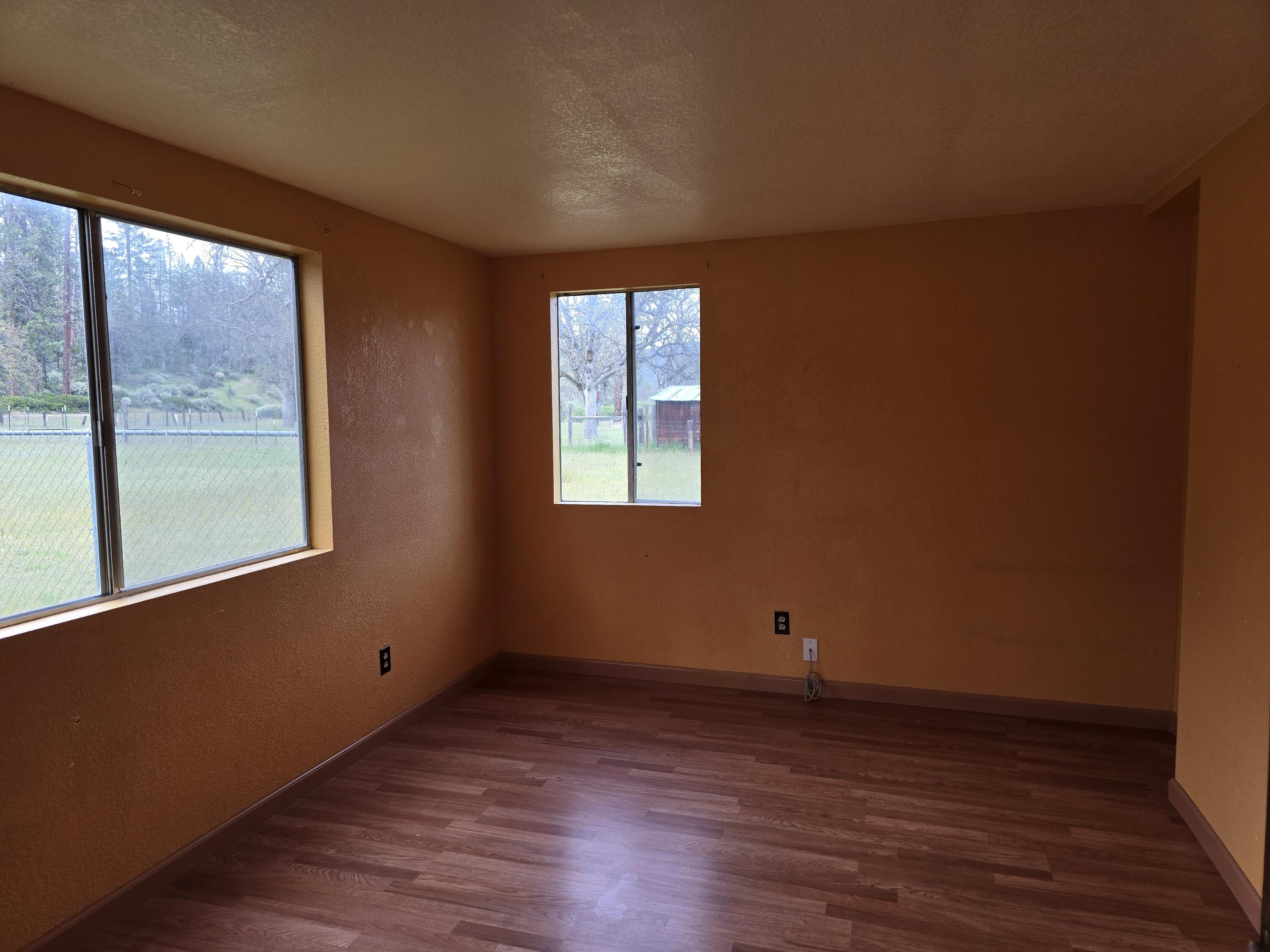 12750 Highway 3 Hayfork, CA 96041 - Photo 19 of 22 a view of a room with wooden floor and windows