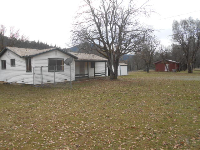 12750 Highway 3 Hayfork, CA 96041 - Photo 2 of 22 a view of a house with a large tree in front of it