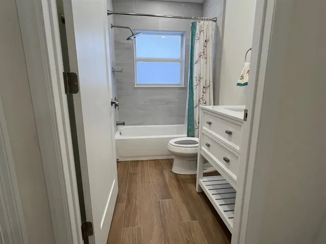 a bathroom with a toilet a sink and a bathtub