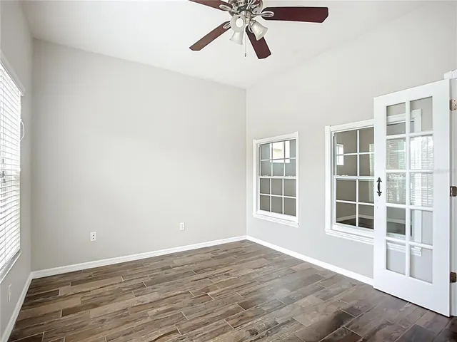 a view of a kitchen with a sink and a window