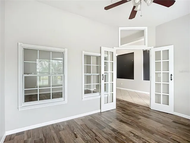 a large kitchen with stainless steel appliances kitchen island granite countertop a refrigerator a stove a sink and a cabinets