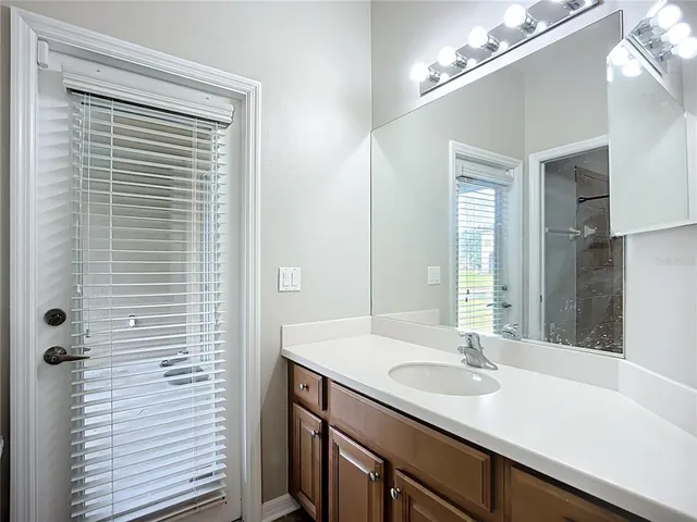 a aerial view of a house with a garden and lake view