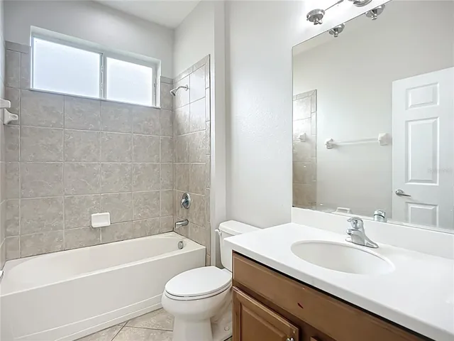 an aerial view of residential houses with outdoor space and swimming pool