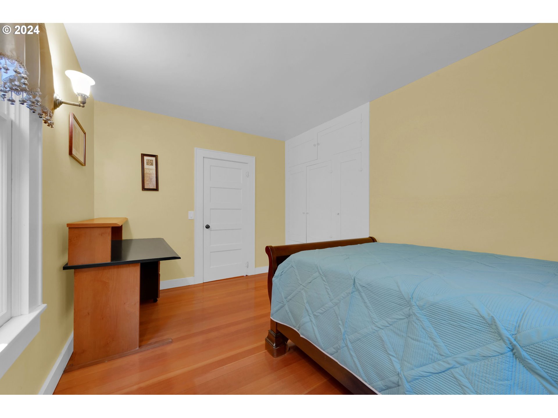 36245 Wagner Lane Cottage Grove, OR 97424 - Photo 18 of 45 a bedroom with a bed and a lamp on table