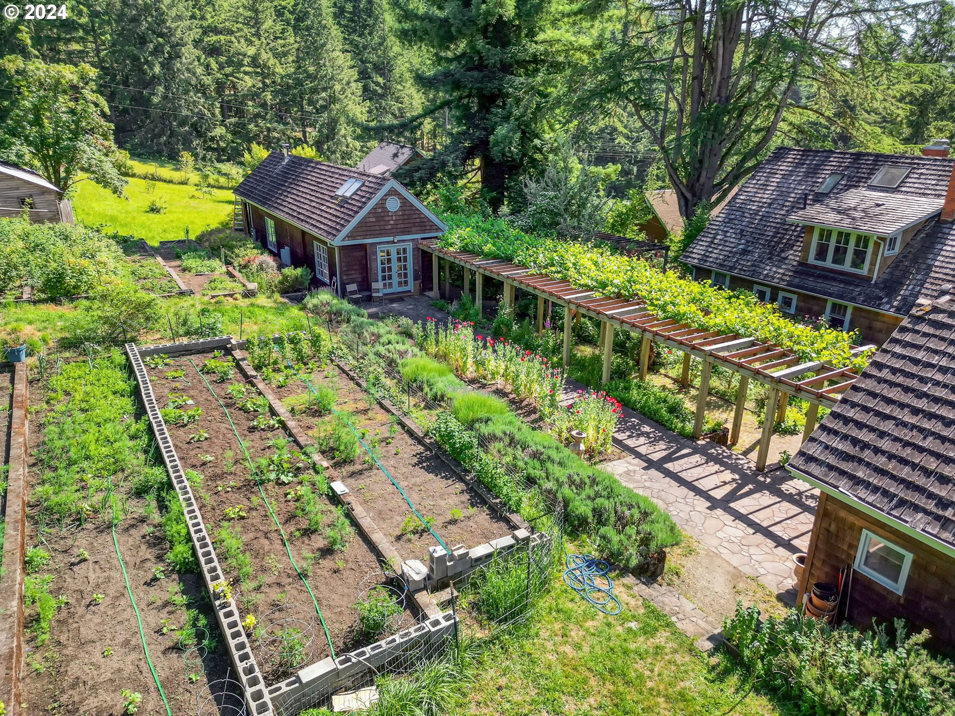 36245 Wagner Lane Cottage Grove, OR 97424 - Photo 29 of 45 an aerial view of a house with a garden