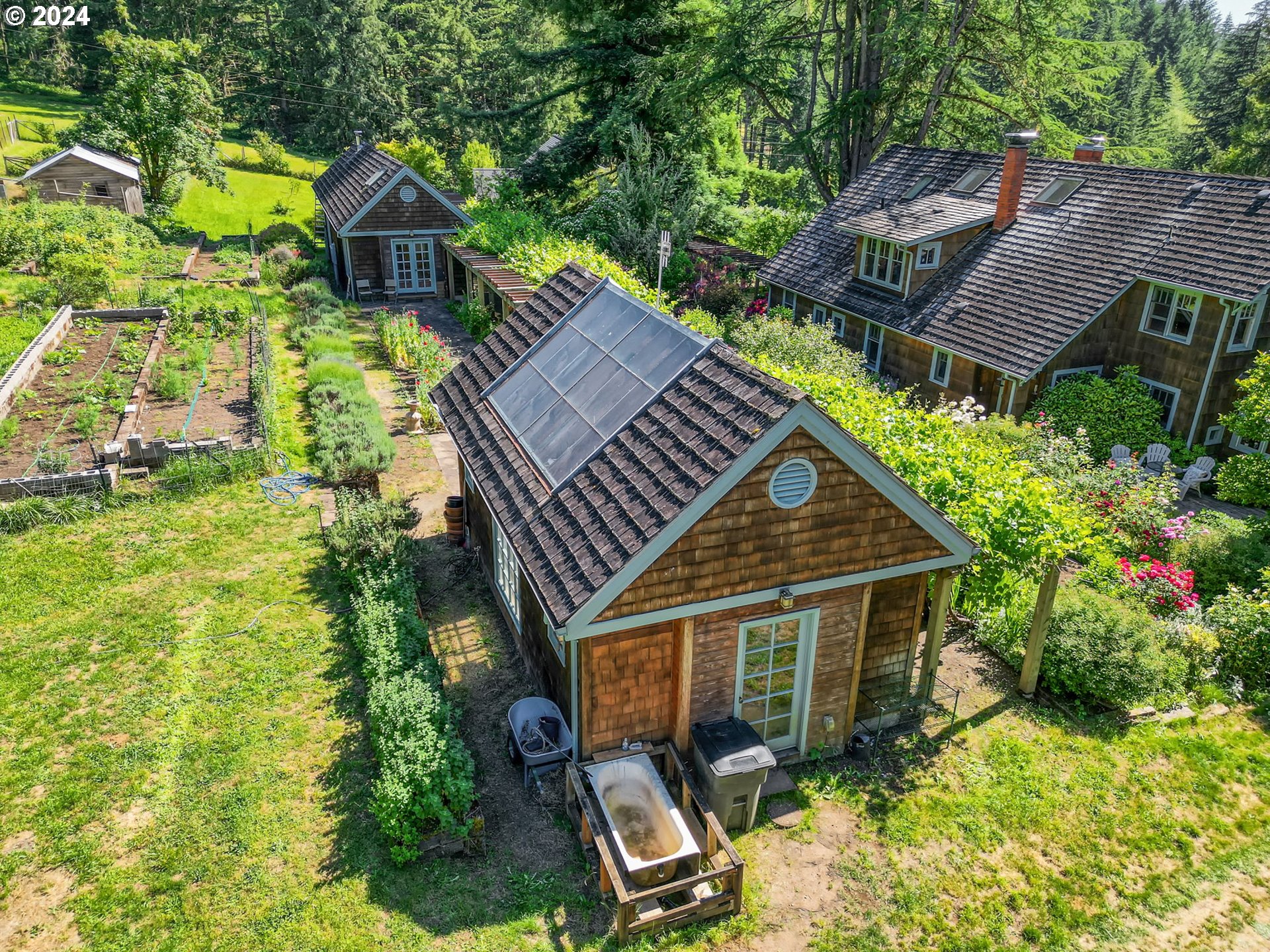 36245 Wagner Lane Cottage Grove, OR 97424 - Photo 30 of 45 a view of a house with a yard and potted plants