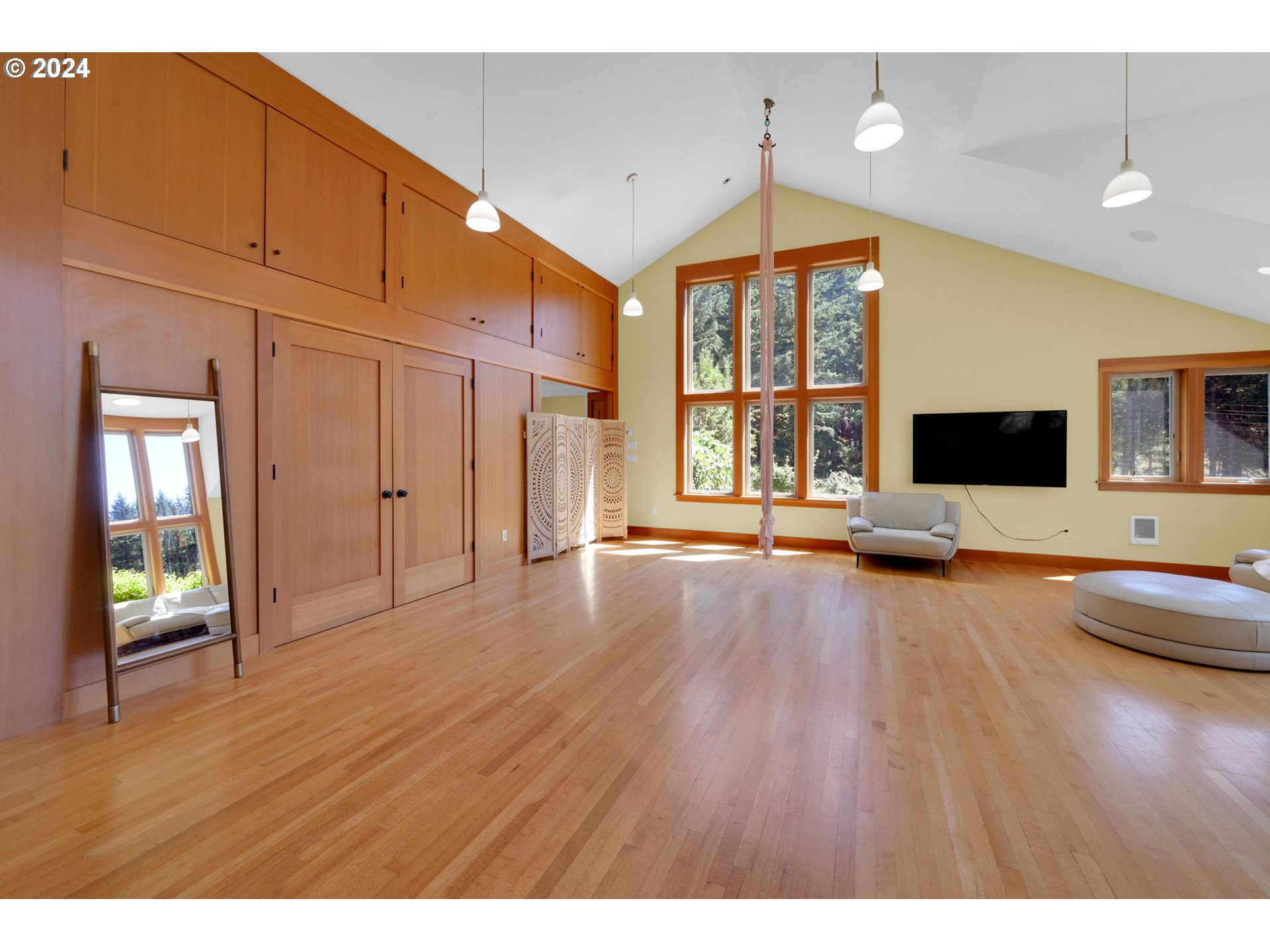36245 Wagner Lane Cottage Grove, OR 97424 - Photo 38 of 45 a view of an empty room with window and wooden floor