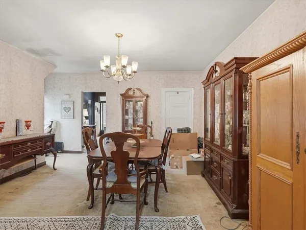 a view of a dining room with furniture and window