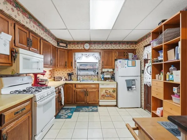 a kitchen with stainless steel appliances granite countertop a stove a sink and dishwasher