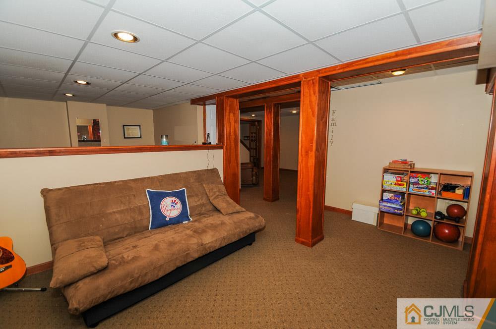 19 Cannon Road Old Bridge, NJ 08857 - Photo 22 of 22 a living room with furniture and a flat screen tv