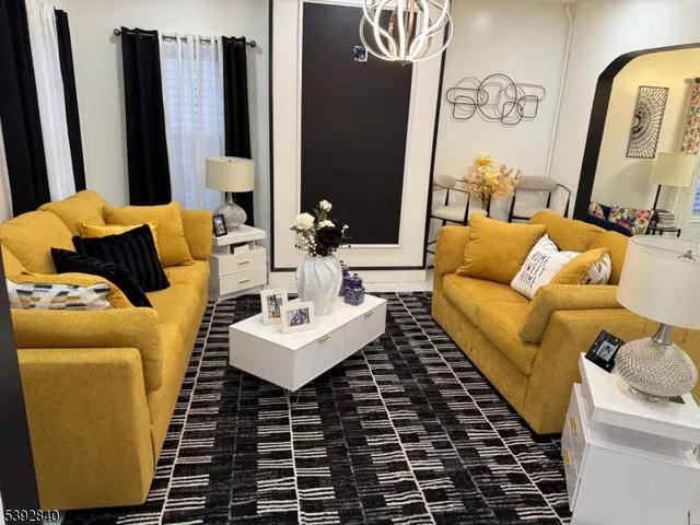 a living room with furniture and a rug