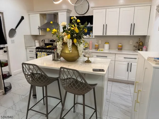 a kitchen with stainless steel appliances granite countertop a sink dishwasher and cabinets with wooden floor