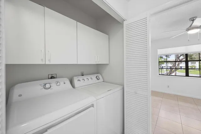 a view of a backyard with wooden fence