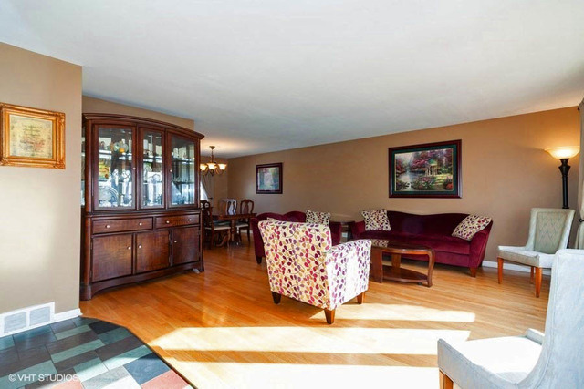 1210 Hemlock Lane Mount Prospect, IL 60056 - Photo 2 of 27 a living room with furniture rug and window