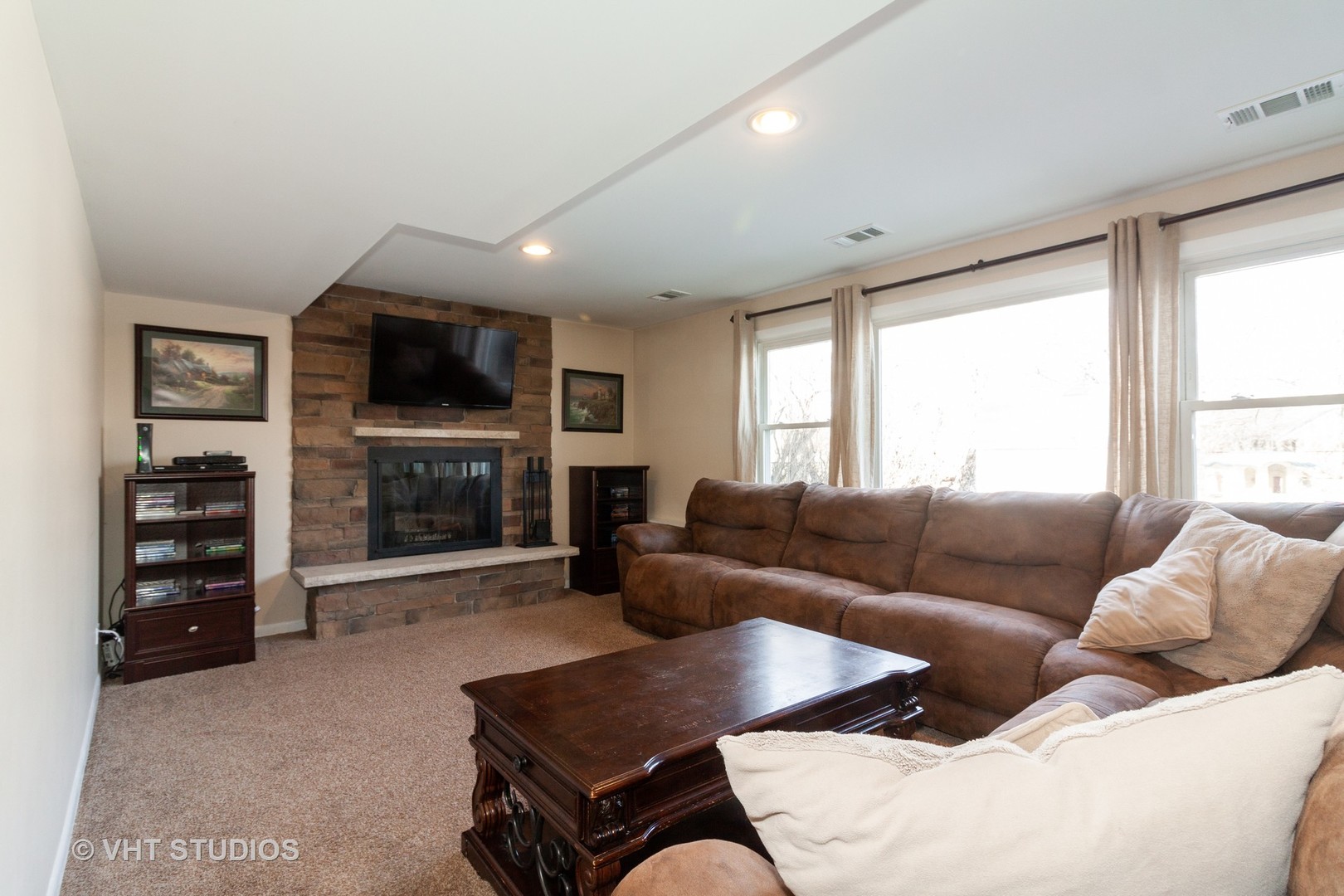 1210 Hemlock Lane Mount Prospect, IL 60056 - Photo 15 of 27 a living room with furniture and a flat screen tv