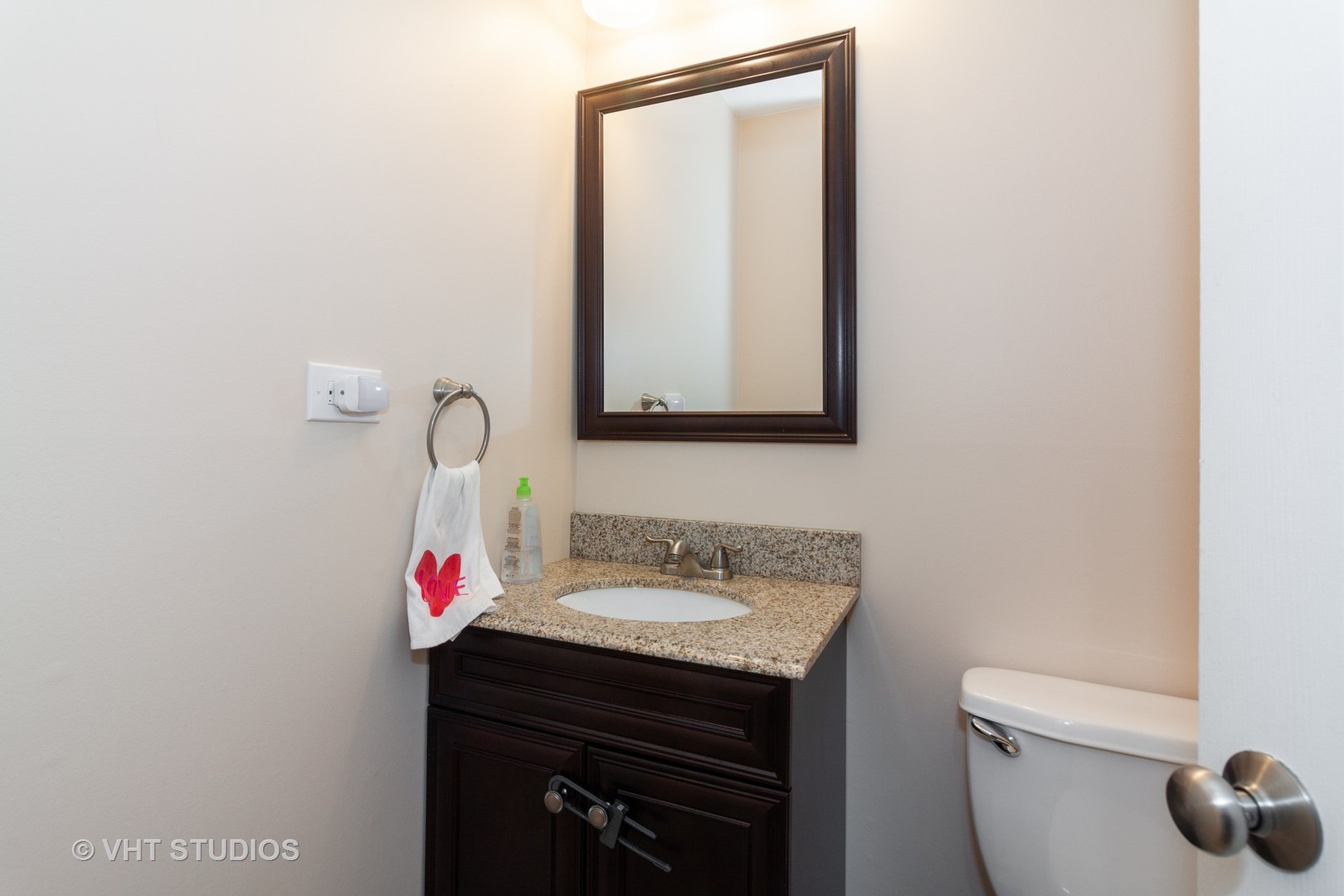 1210 Hemlock Lane Mount Prospect, IL 60056 - Photo 17 of 27 a bathroom with a sink vanity and toilet