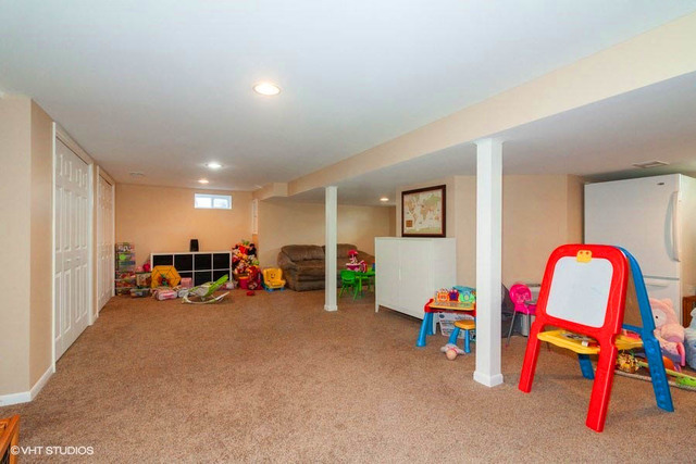 1210 Hemlock Lane Mount Prospect, IL 60056 - Photo 18 of 27 a view of a room with furniture and toys