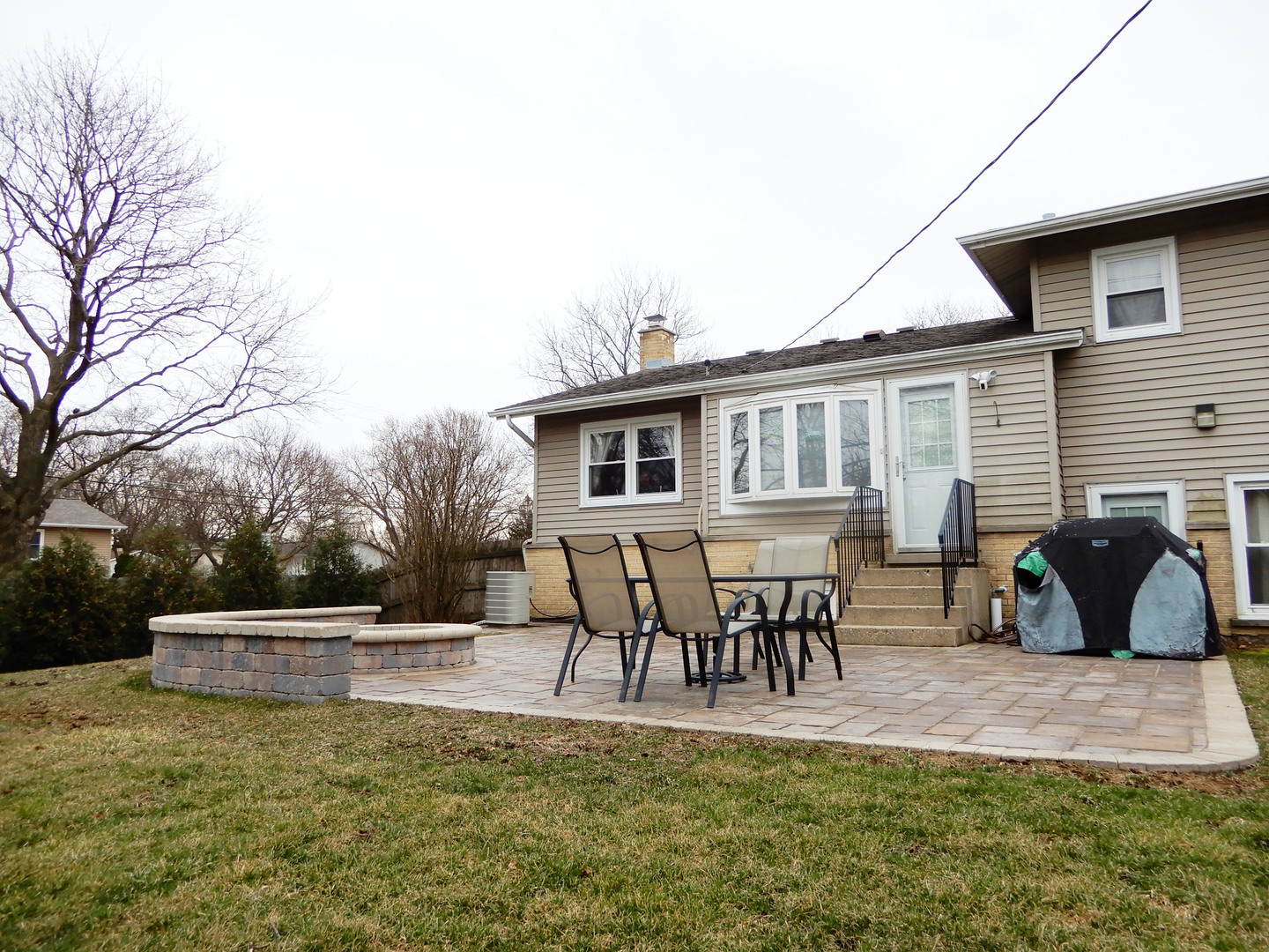 1210 Hemlock Lane Mount Prospect, IL 60056 - Photo 19 of 27 a roof deck with table and chairs and potted plants