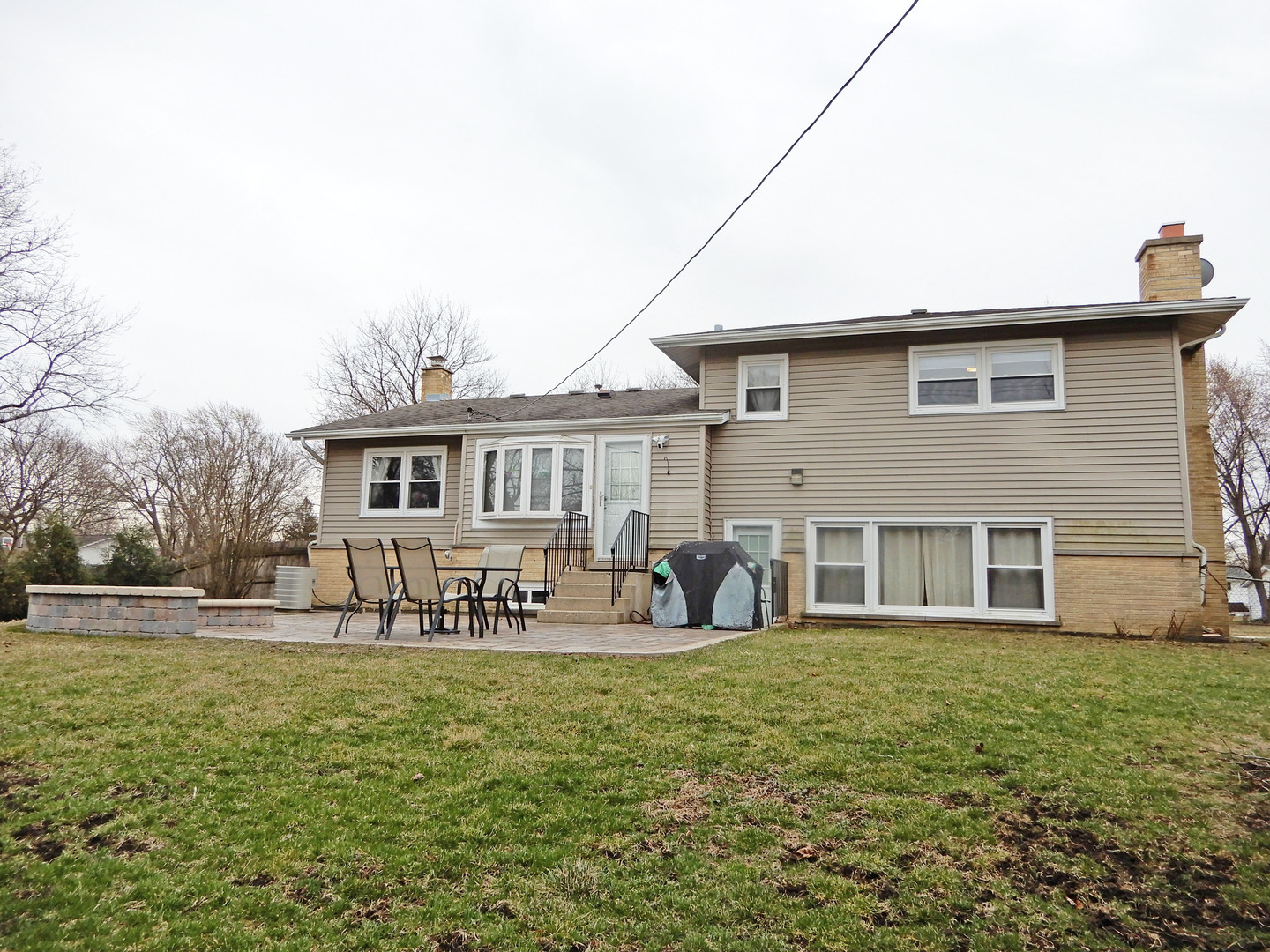 1210 Hemlock Lane Mount Prospect, IL 60056 - Photo 22 of 27 a front view of house with yard and seating space