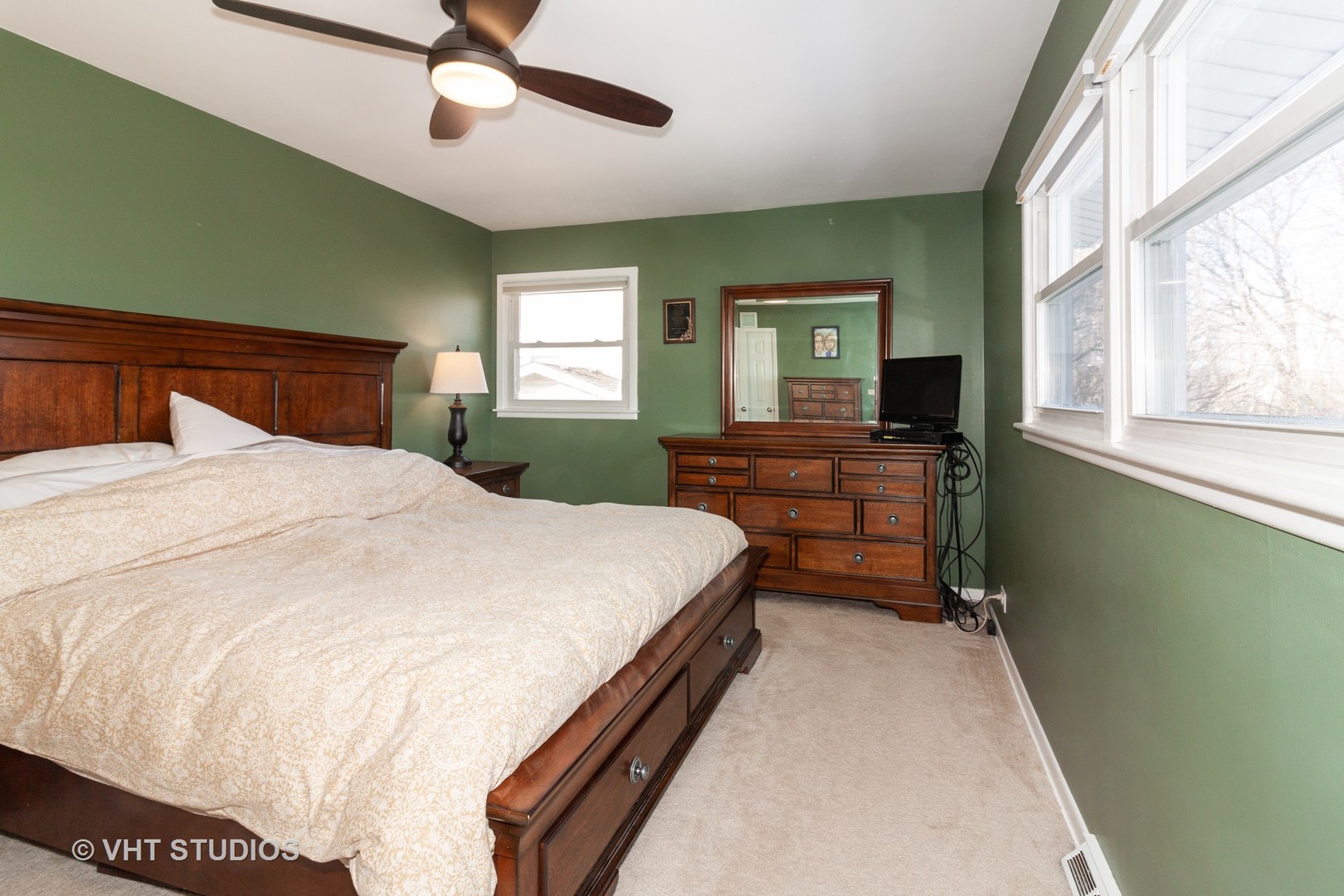 1210 Hemlock Lane Mount Prospect, IL 60056 - Photo 8 of 27 a bedroom with a bed and a flat tv screen on dresser