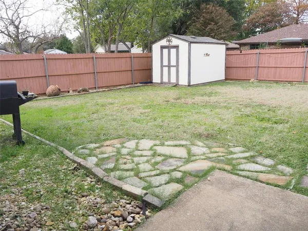 a house view with a garden space