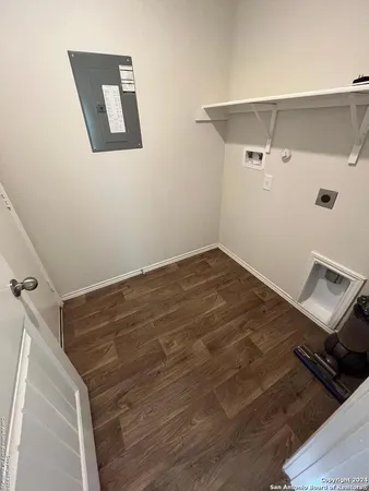 a view of a room with wooden floor and air conditioner