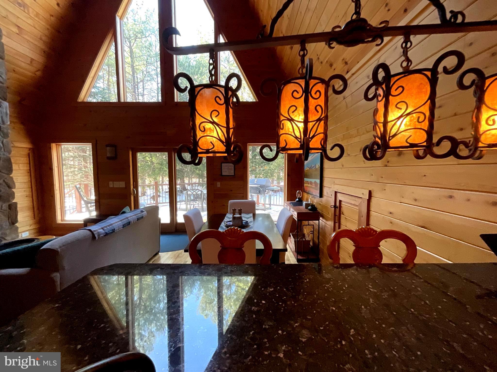 4839 Graces Cabin Road Romney, WV 26757 - Photo 1 of 26 a view of a chairs and table in the patio