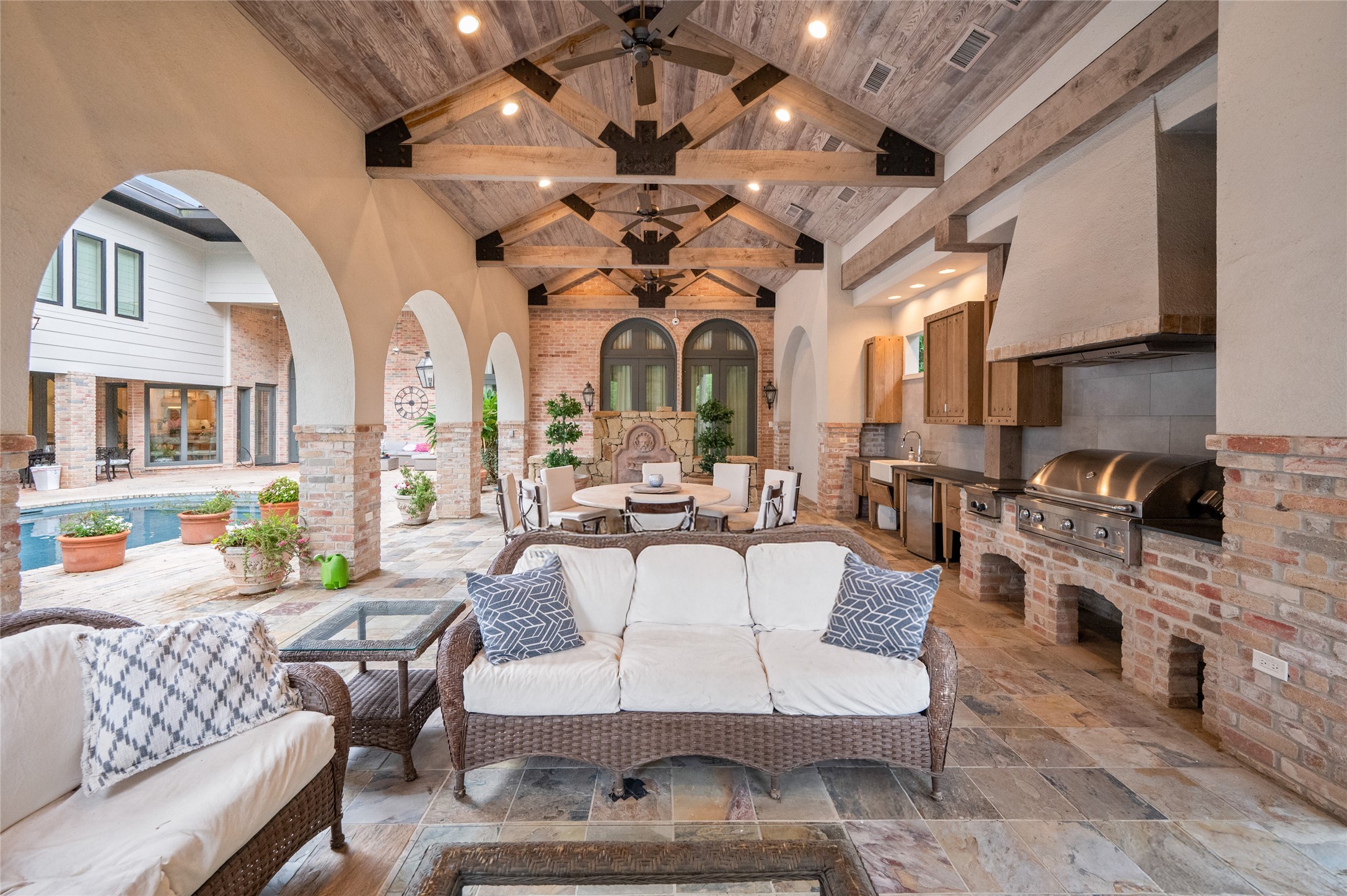 11518 Shadow Way Street Houston, TX 77024 - Photo 46 of 50 The arched pavilion invites comfortable outdoor living, offering shade, style, and a perfect vantage point overlooking the pool and gardens.