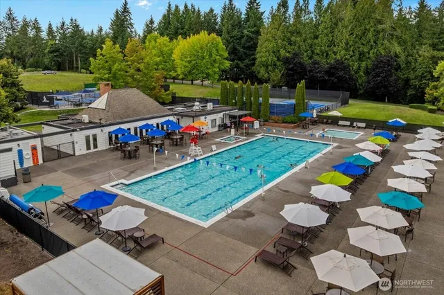 an outdoor space with furniture and umbrella