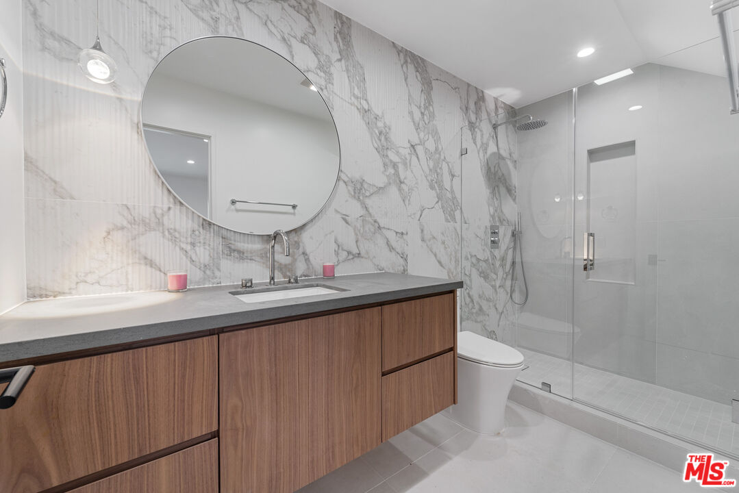 3305 Ocean Front Walk, Unit 1 & 2 Marina del Rey, CA 90292 - Photo 16 of 44 a bathroom with a sink a toilet and shower