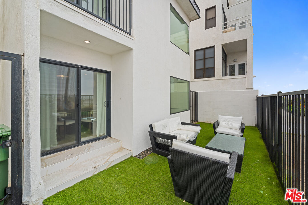 3305 Ocean Front Walk, Unit 1 & 2 Marina del Rey, CA 90292 - Photo 19 of 44 a view of an house with backyard and furniture