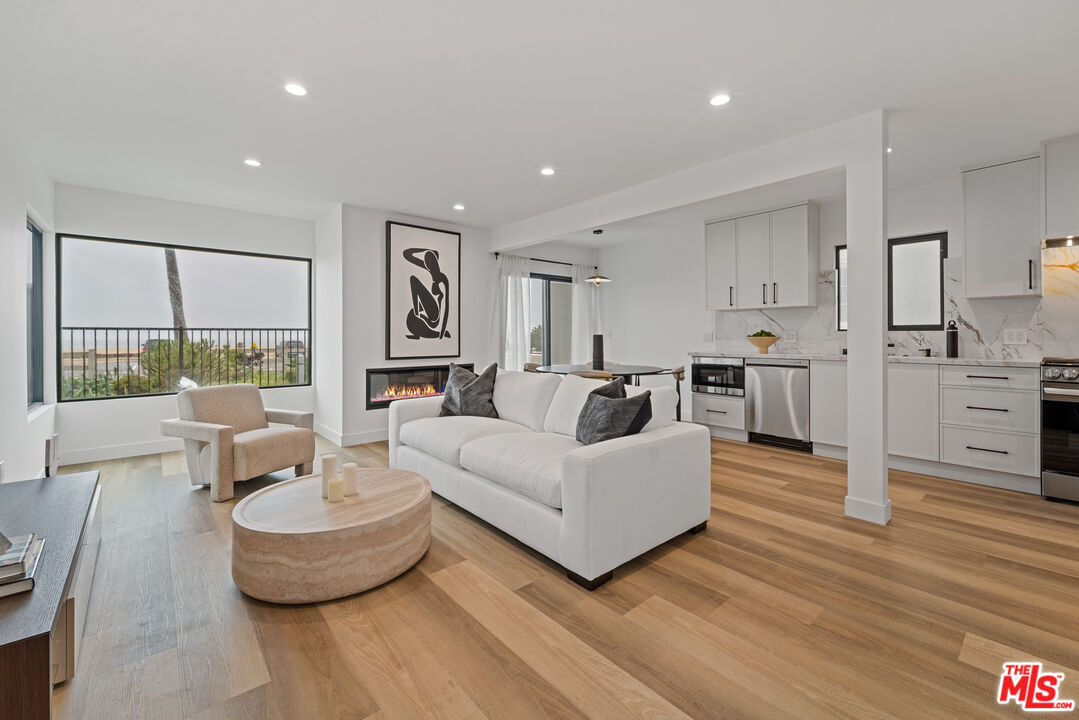 3305 Ocean Front Walk, Unit 1 & 2 Marina del Rey, CA 90292 - Photo 2 of 44 a living room with furniture and a large window
