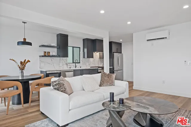 a living room with furniture and a table