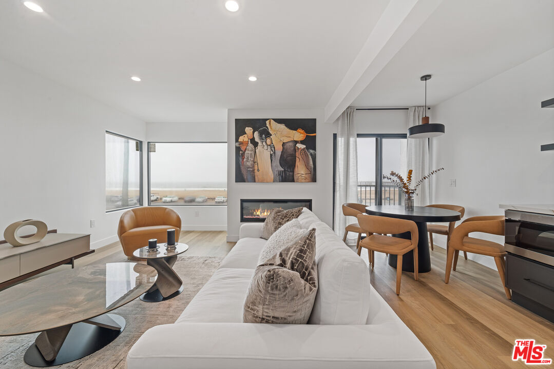 3305 Ocean Front Walk, Unit 1 & 2 Marina del Rey, CA 90292 - Photo 26 of 44 a living room with furniture and a window