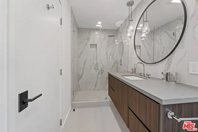 a bathroom with a double vanity sink and a mirror