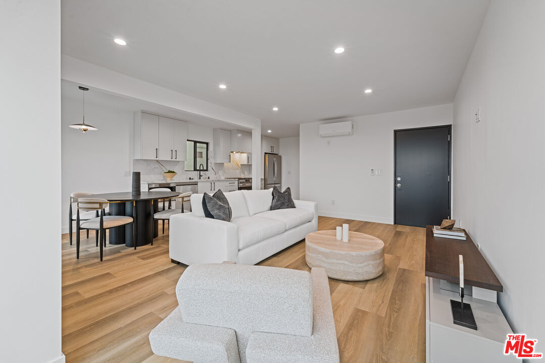 3305 Ocean Front Walk, Unit 1 & 2 Marina del Rey, CA 90292 - Photo 4 of 44 a living room with furniture and a table