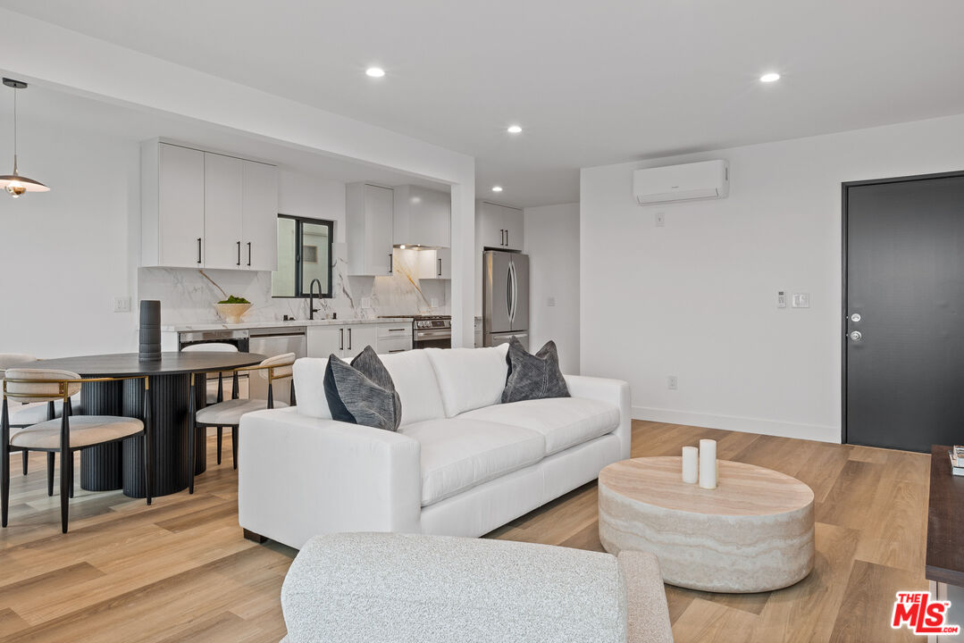 3305 Ocean Front Walk, Unit 1 & 2 Marina del Rey, CA 90292 - Photo 5 of 44 a living room with furniture and a wooden floor