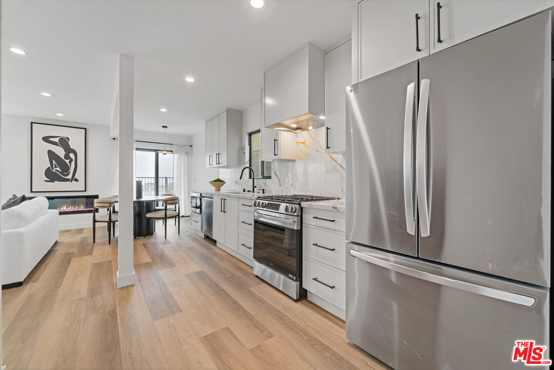 3305 Ocean Front Walk, Unit 1 & 2 Marina del Rey, CA 90292 - Photo 7 of 44 a kitchen with stainless steel appliances a refrigerator sink and stove