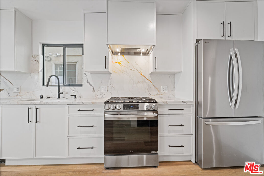 3305 Ocean Front Walk, Unit 1 & 2 Marina del Rey, CA 90292 - Photo 8 of 44 a kitchen with a stove and a refrigerator