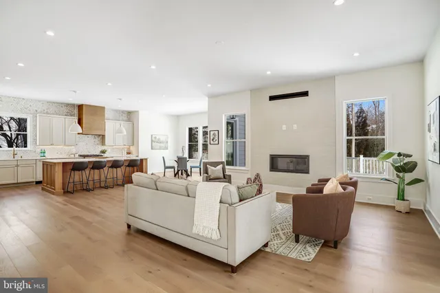 a living room with furniture wooden floor and a fireplace
