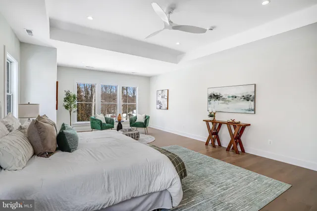 a bed room with a bed and a chair